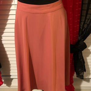 Foley deep coral colored skirt.